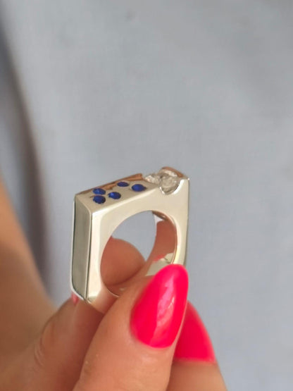 Contemporary Engagement Ring: Moissanite Silver Solitaire with Small Cubic Zirconia accents