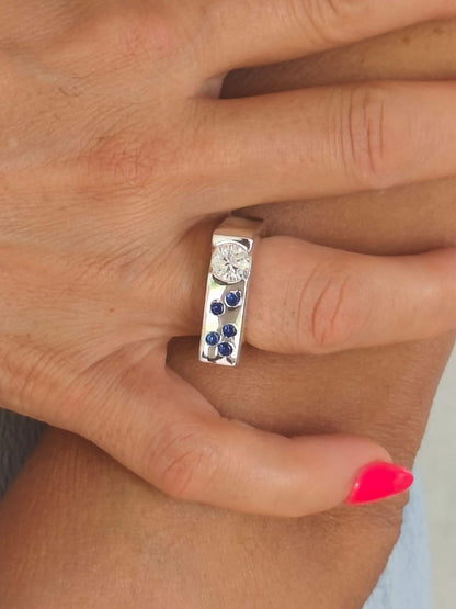 Contemporary Engagement Ring: Moissanite Silver Solitaire with Small Cubic Zirconia accents