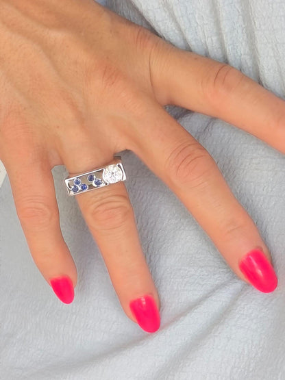Contemporary Engagement Ring: Moissanite Silver Solitaire with Small Cubic Zirconia accents