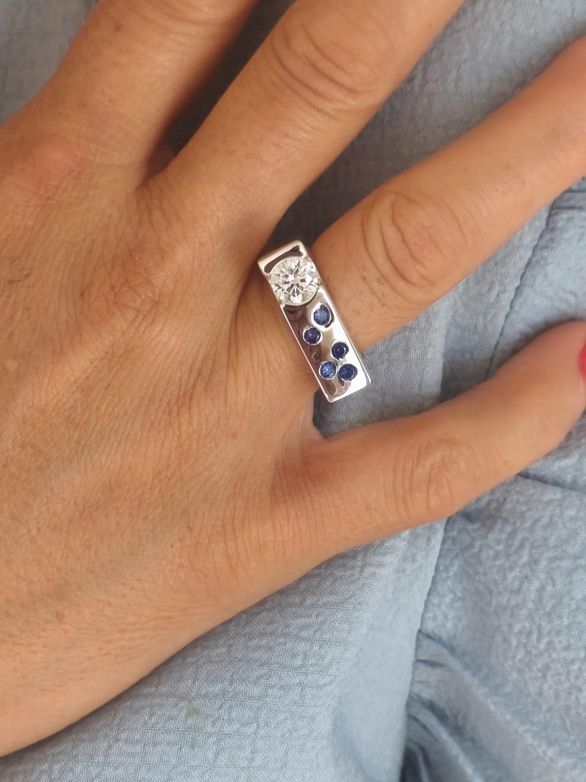 Contemporary Engagement Ring: Moissanite Silver Solitaire with Small Cubic Zirconia accents
