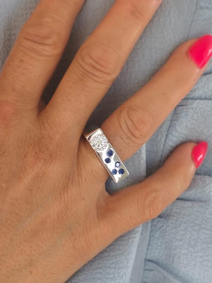 Contemporary Engagement Ring: Moissanite Silver Solitaire with Small Cubic Zirconia accents