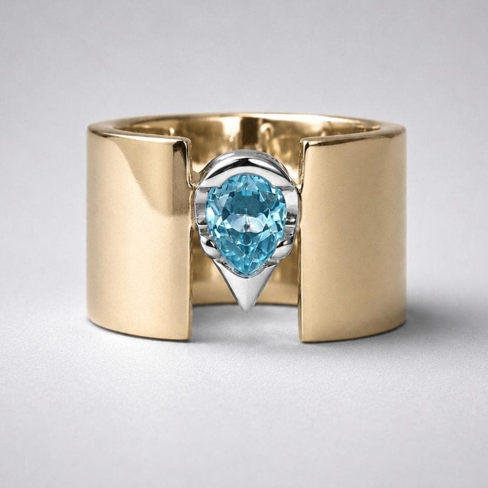 Wide Band Engagement Ring: Blue Topaz Pear Shape, Bi-Metal Gold Tone And Silver