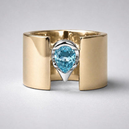 Wide Band Engagement Ring: Blue Topaz Pear Shape, Bi-Metal Gold Tone And Silver