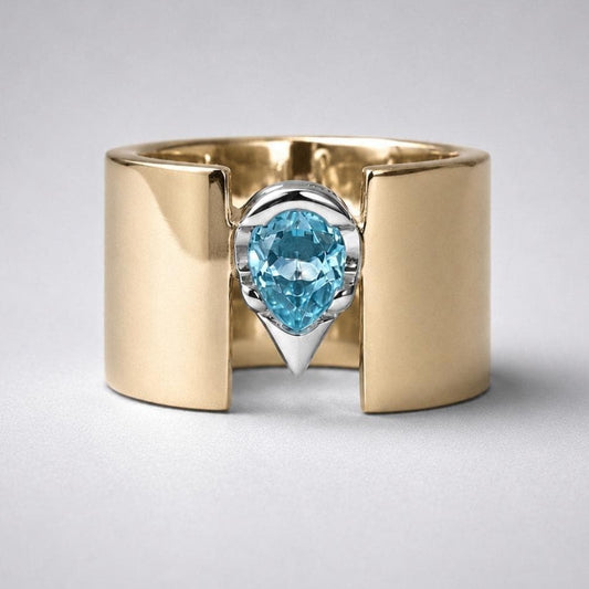 Wide Band Engagement Ring: Blue Topaz Pear Shape, Bi-Metal Gold Tone And Silver